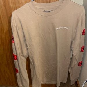 A tan long sleeve graphic tee never used in size medium